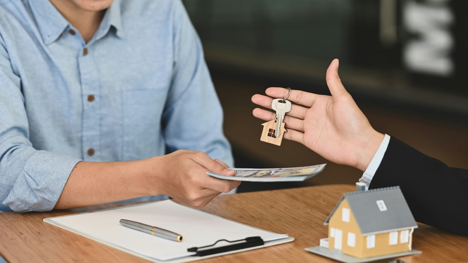 Keys being handed over for a first home purchase