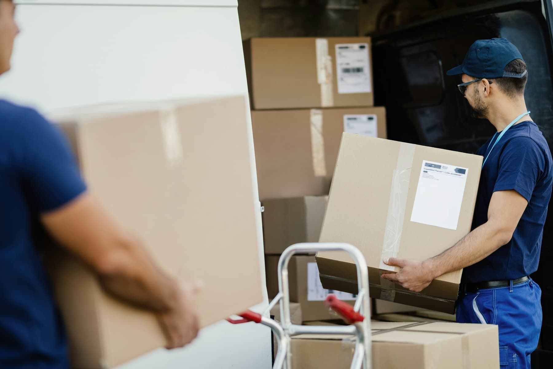 Removal team carrying boxes during a home move